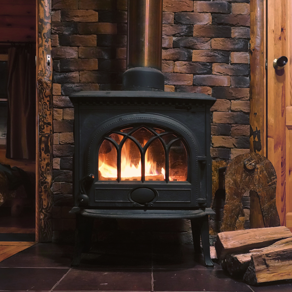 Warming up in front of the (polluting) fireplace