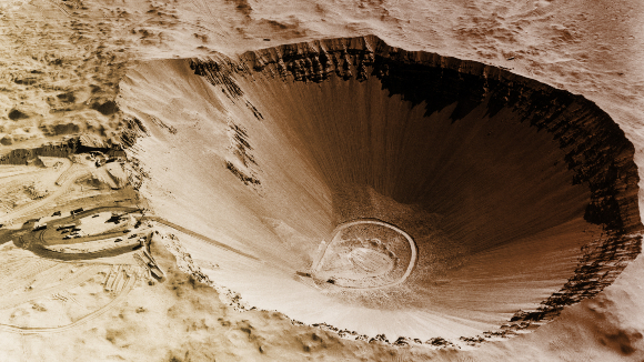 Sedan crater, 400 meters wide, formed by a controlled nuclear blast in Nevada | Photo: OMIKRON / SCIENCE PHOTO LIBRARY