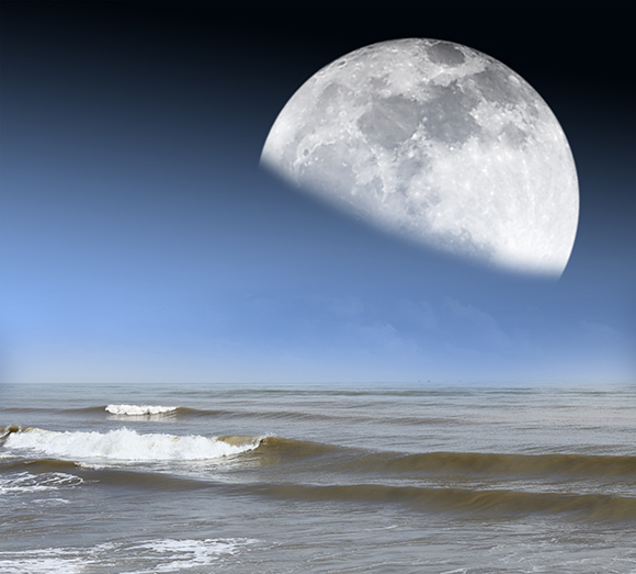 A simulation of the Moon over an ocean shore | Image: Gwoeii, Shutterstock